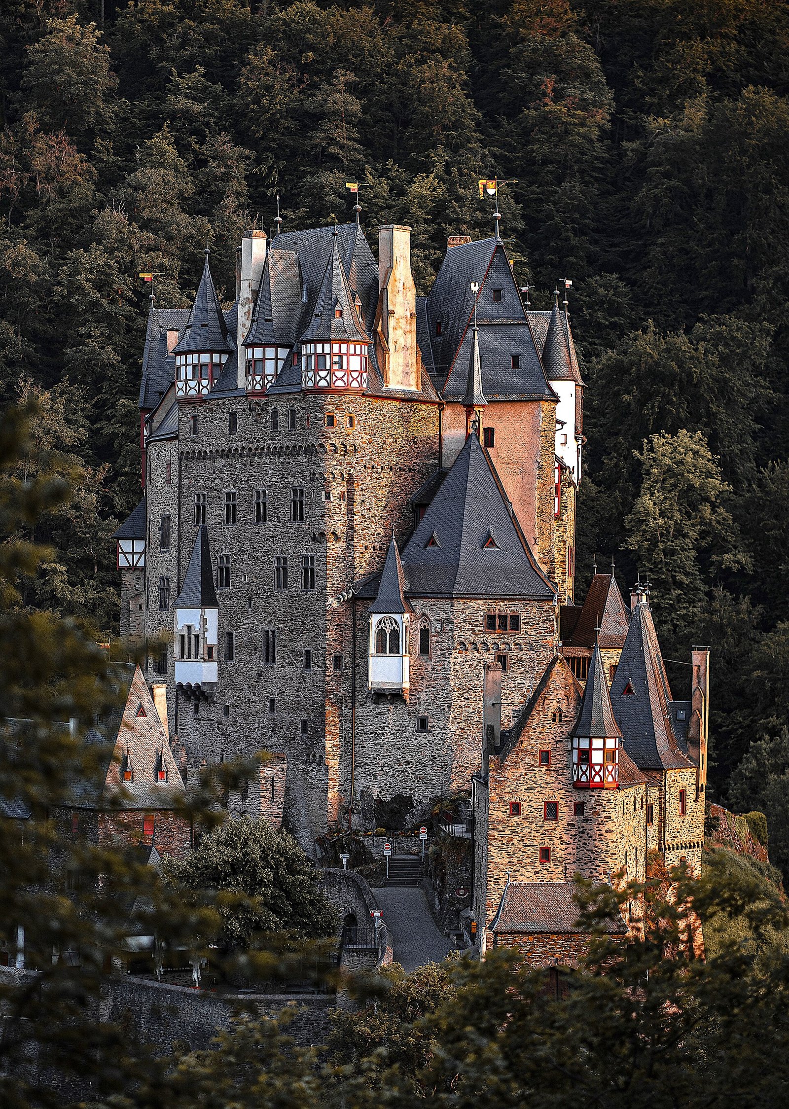Burg Eltz rising from a wooded valley near the Moselle