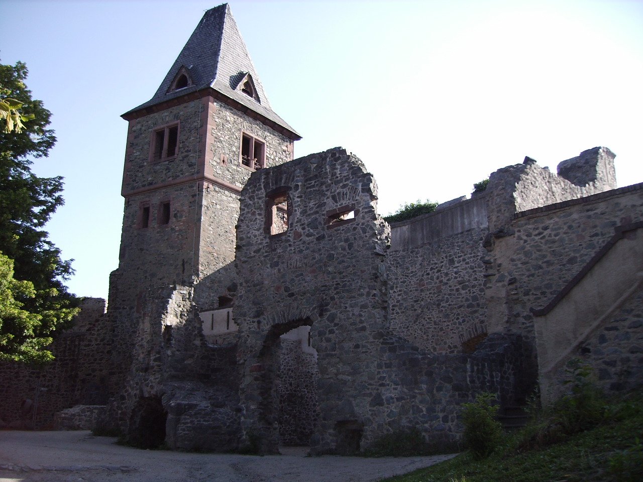 The ruined towers of Frankenstein Castle on a wooded hill near Darmstadt