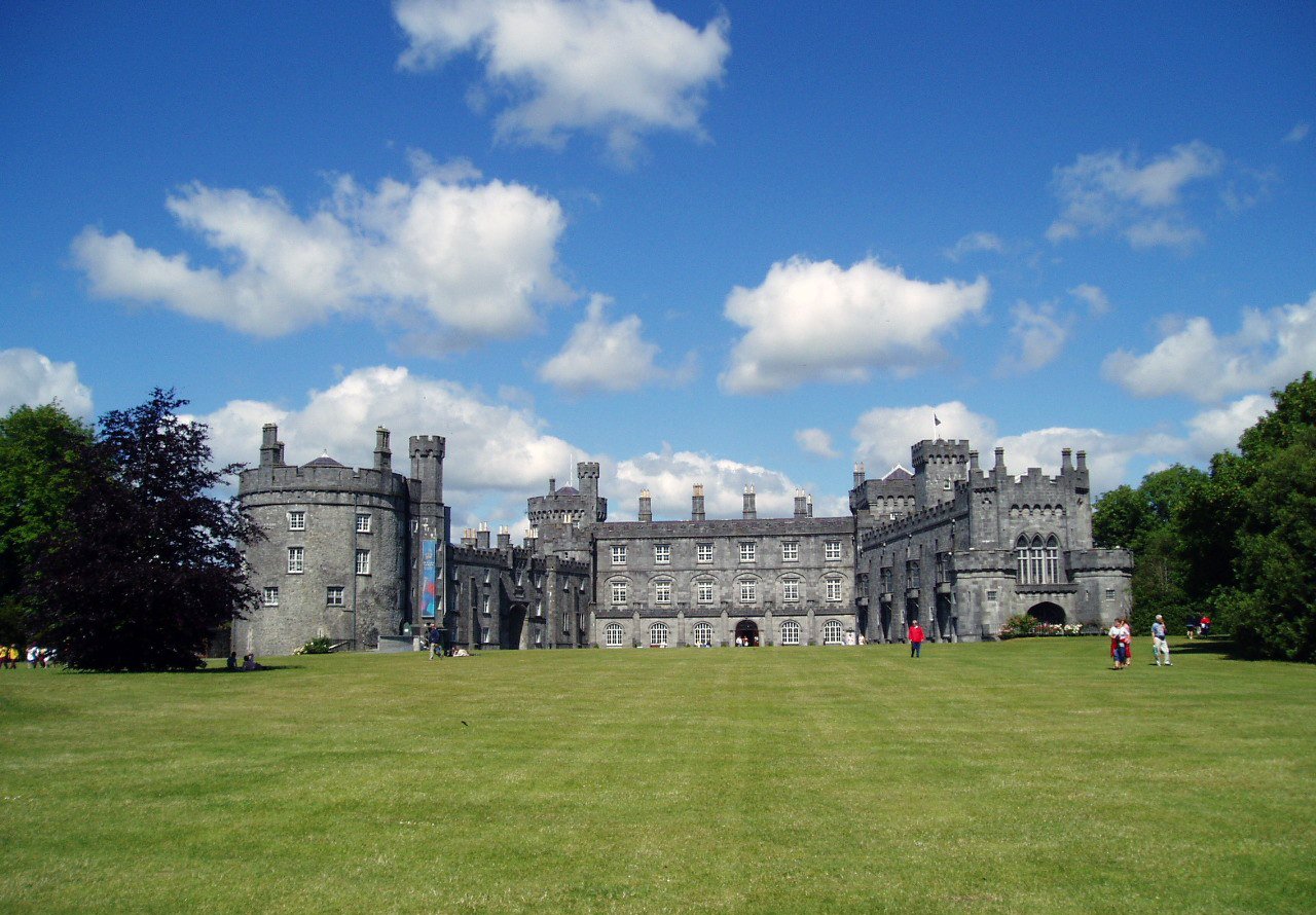Kilkenny Castle's towers and lawns beside the River Nore
