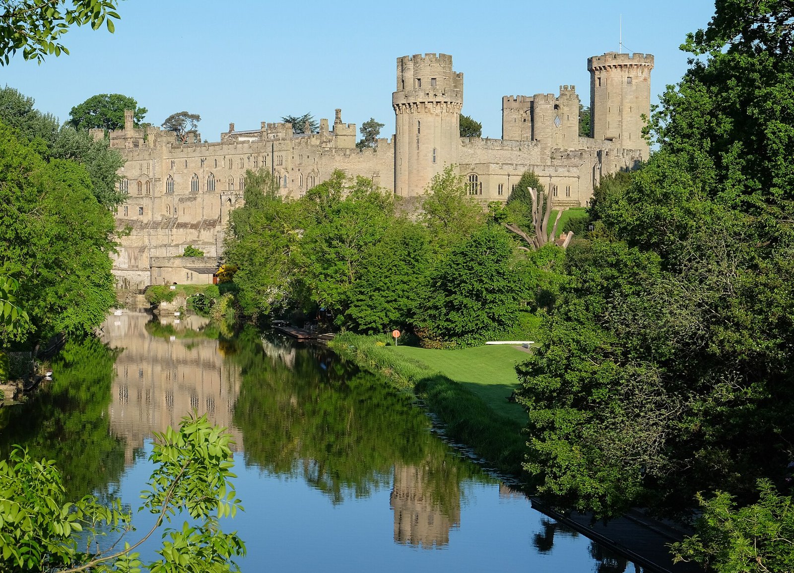 Warwick Castle's towers rising above the River Avon